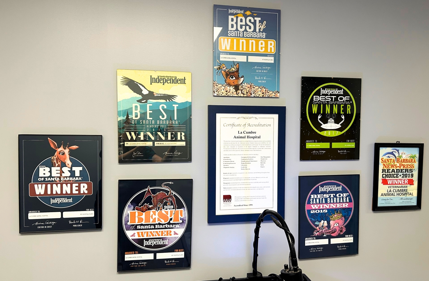 Wall of local awards and accreditations given to LCAH.